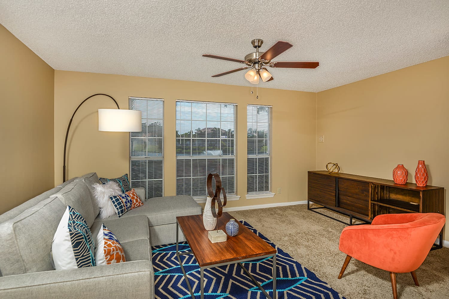 Living room with large windows at Royal St. George at the Villages Apartment Homes in West Palm Beach, Florida