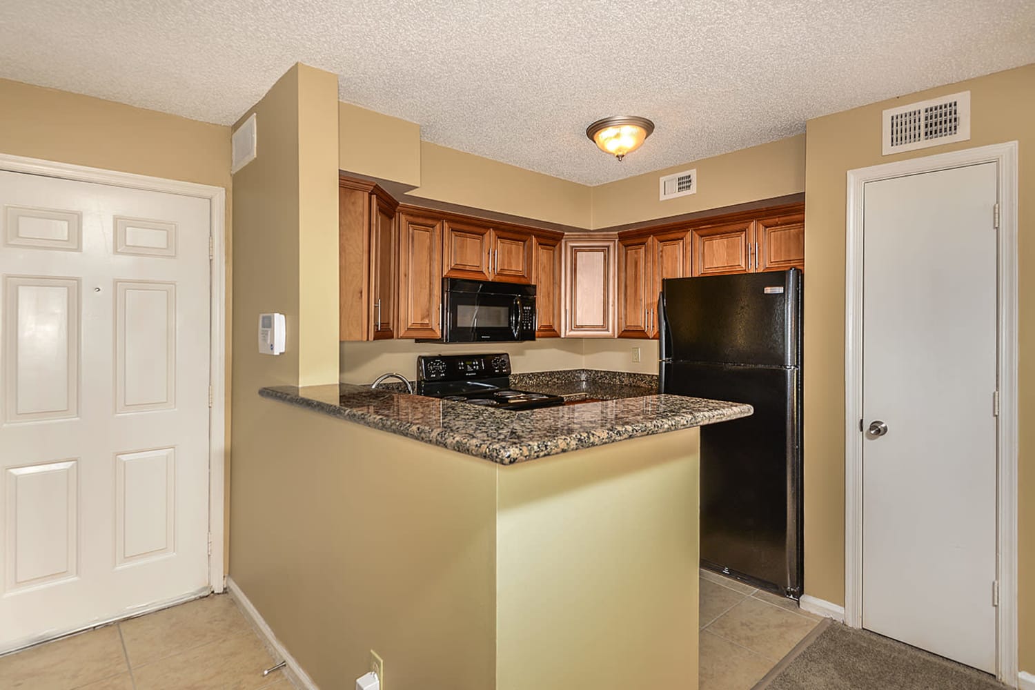 Model kitchen at Royal St. George at the Villages Apartment Homes in West Palm Beach, Florida