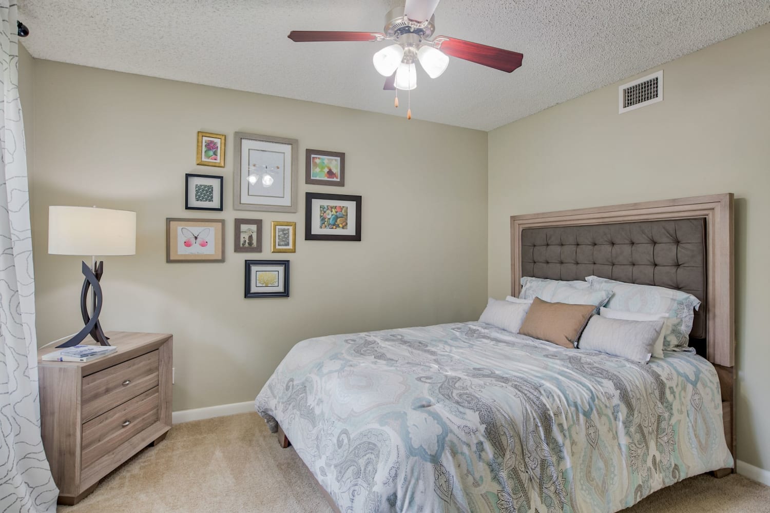 Bedroom with ceiling fan at Village Place Apartment Homes in West Palm Beach, Florida
