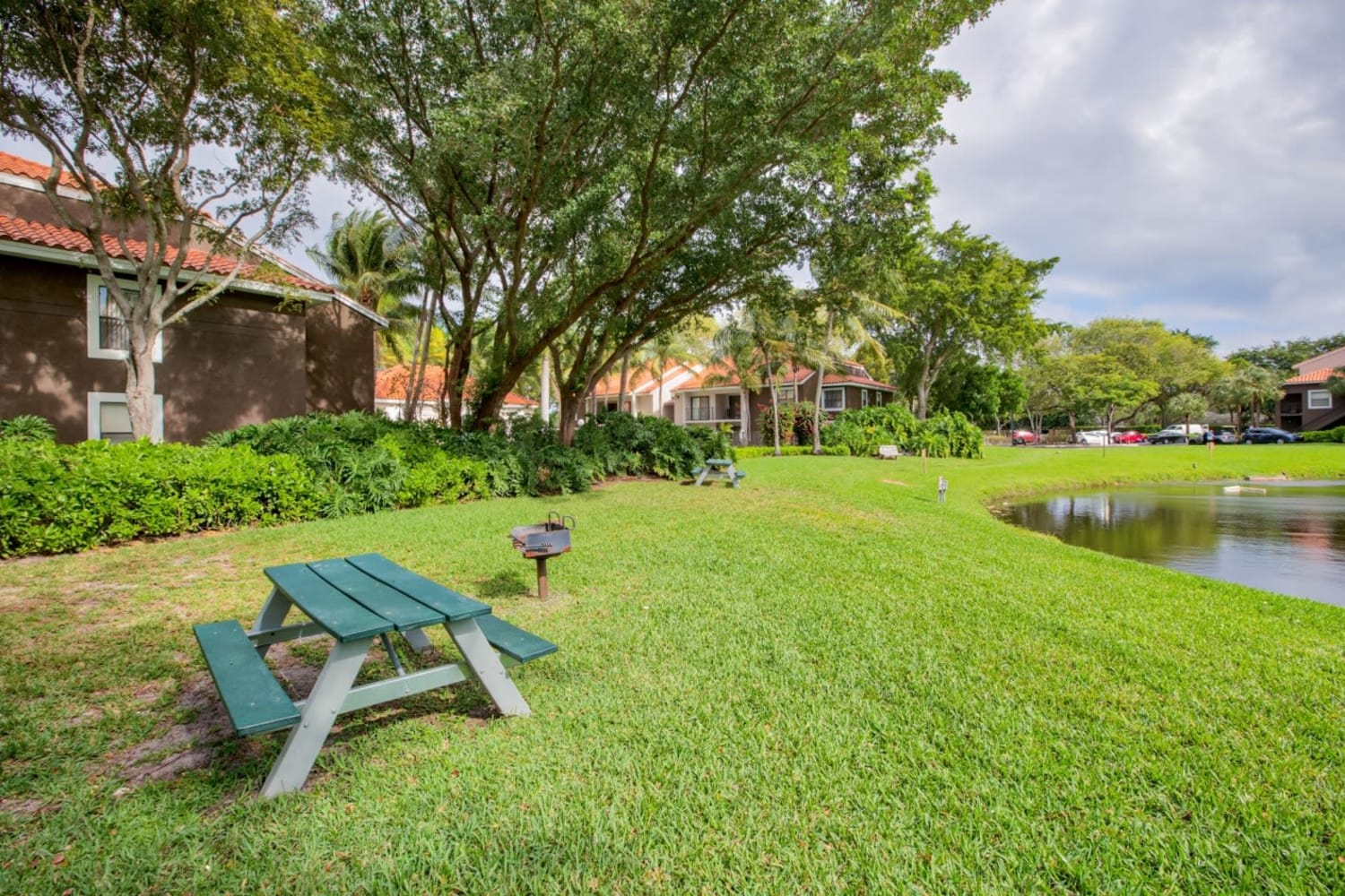 Picnic table on the lawn at Village Place Apartment Homes in West Palm Beach, Florida