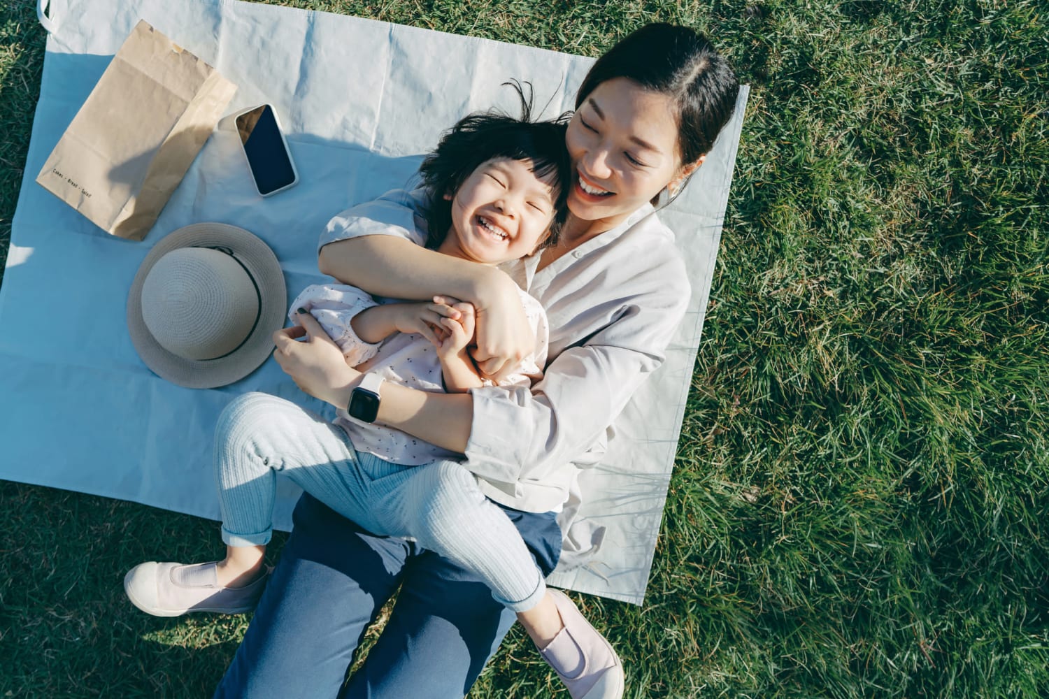 A woman and her child having a great time at Mission Rock Residential in Denver, Colorado