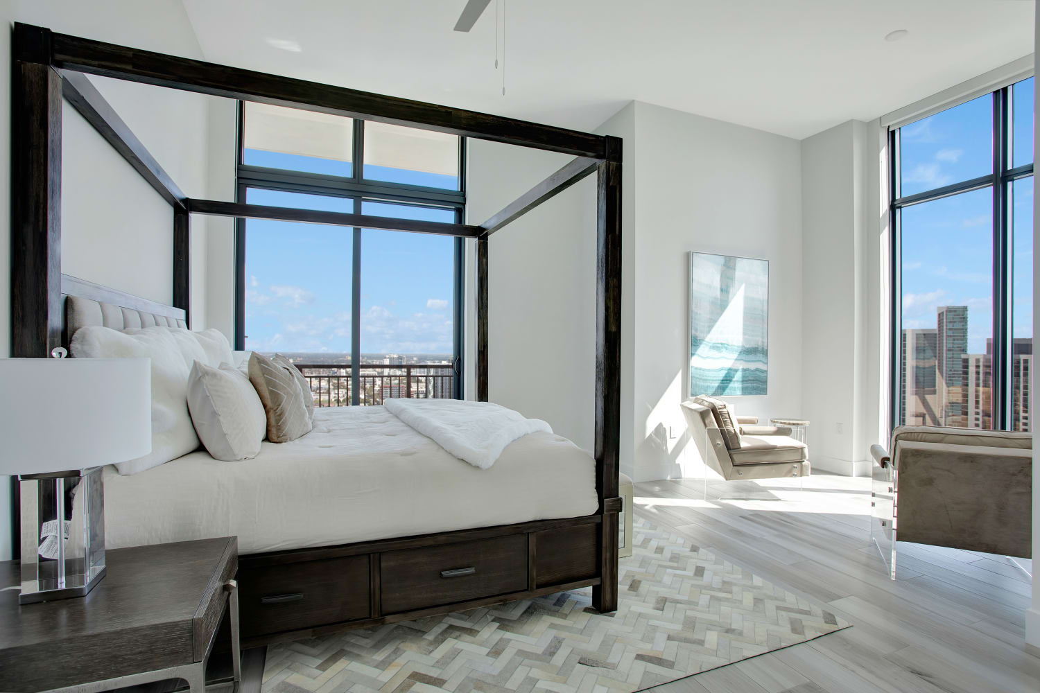 Model bedroom with a large area rug at ParkLine Miami in Miami, Florida