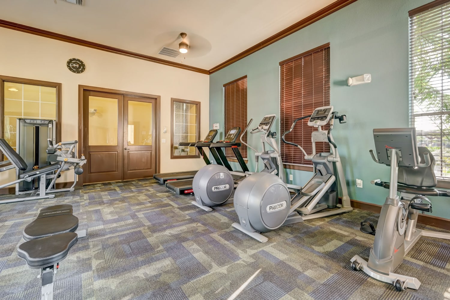 Fitness center cardio equipment at Chateau Mirage Apartment Homes in Lafayette, Louisiana 