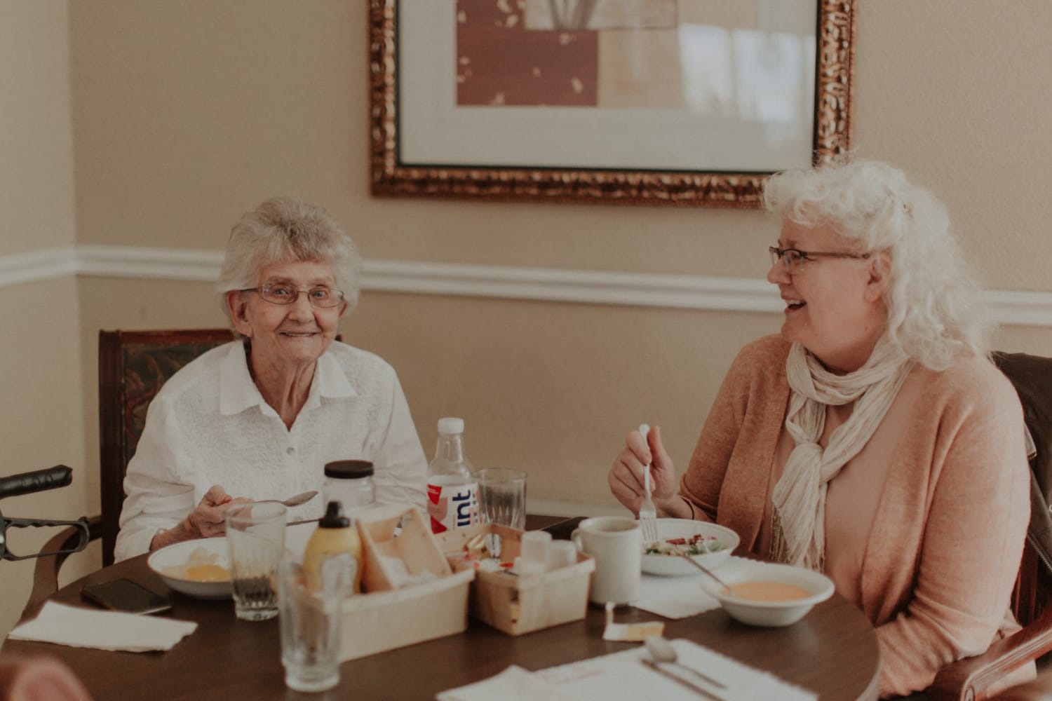 2 residents dining together at The Whitcomb Senior Living Tower in St. Joseph, Michigan