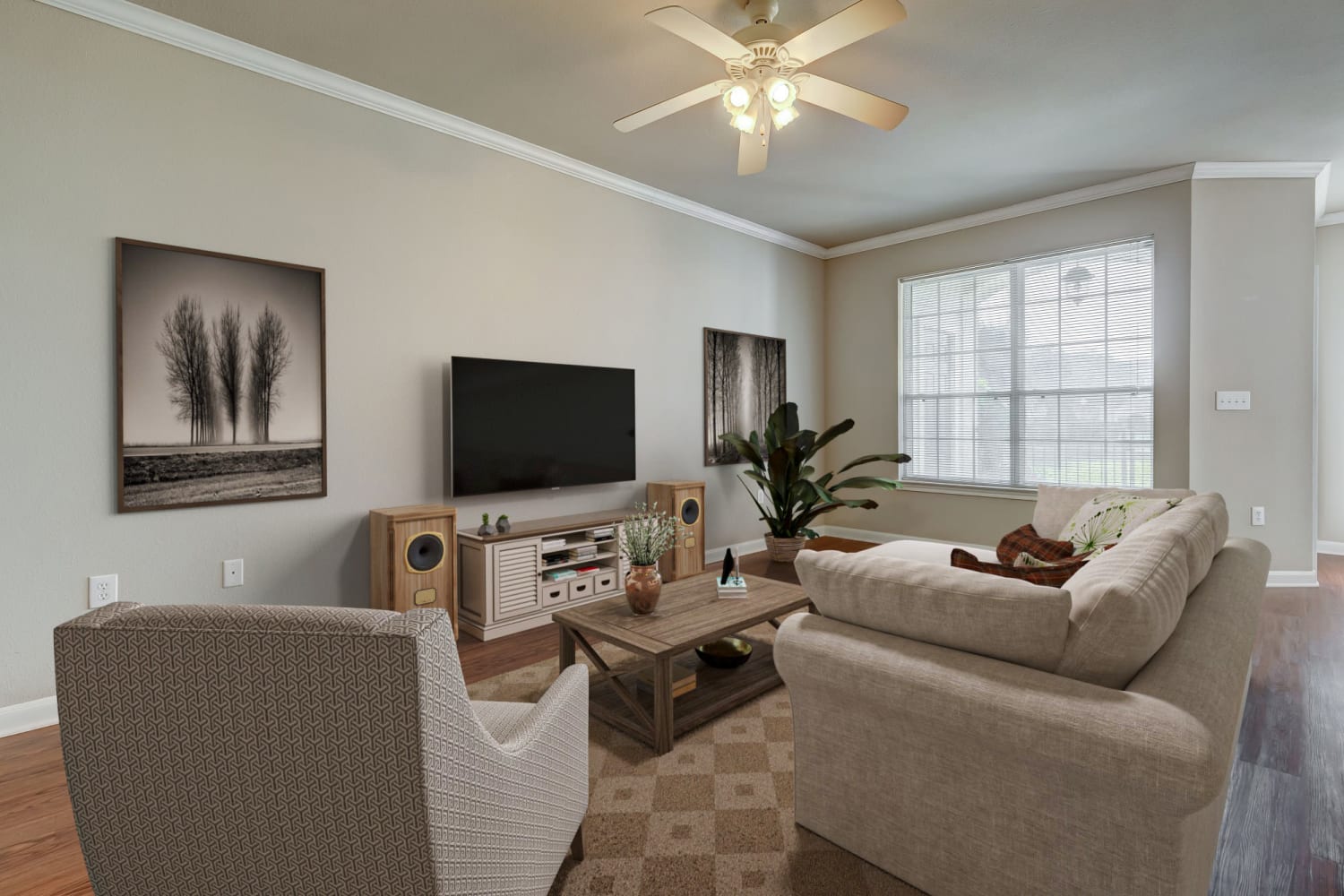 Living room with large windows at Chateau des Lions Apartment Homes in Lafayette, Louisiana