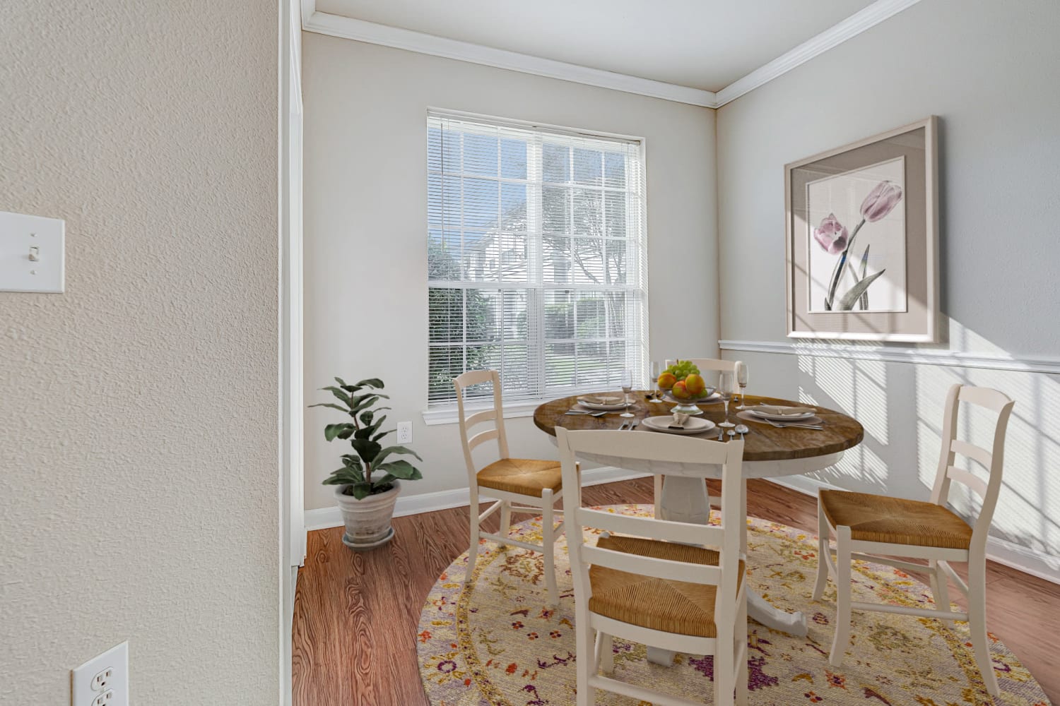 Dining area with large windows at Chateau des Lions Apartment Homes in Lafayette, Louisiana