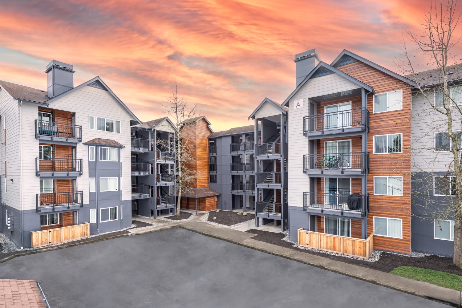 Exterior of Redmond Place Apartments community buildings at sunset in Redmond, Washington