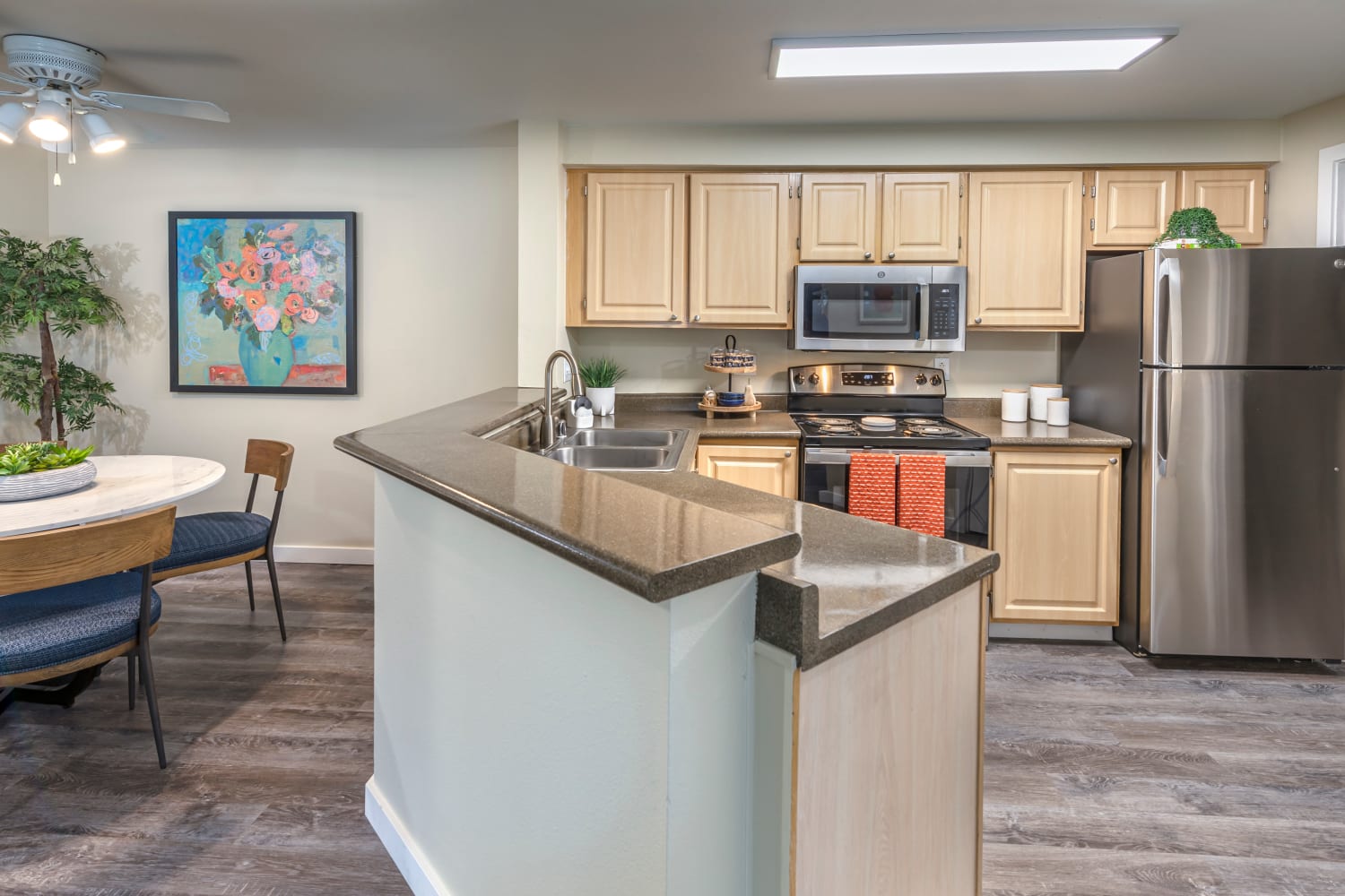 Kitchen and dining room area at Redmond Place Apartments in Redmond, Washington