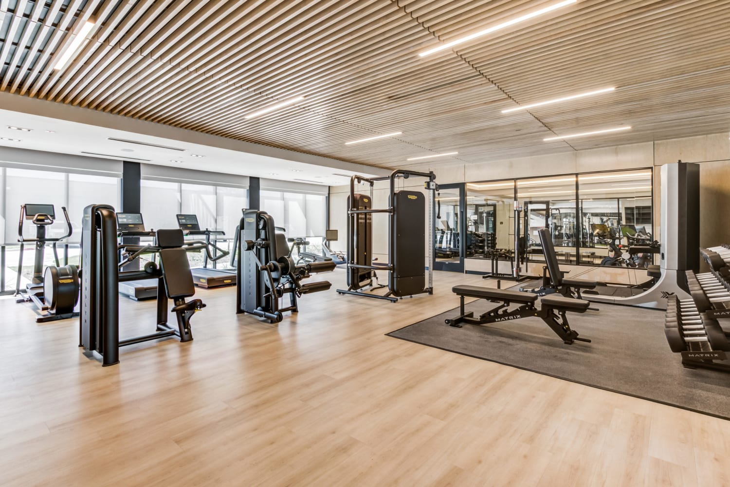 Large fitness center at Mezzo Apartments in Aubrey, Texas