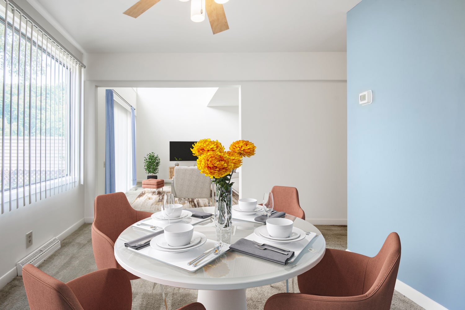 Beautiful dining area with a ceiling fan at Emerald Springs Apartments in Painted Post, New York