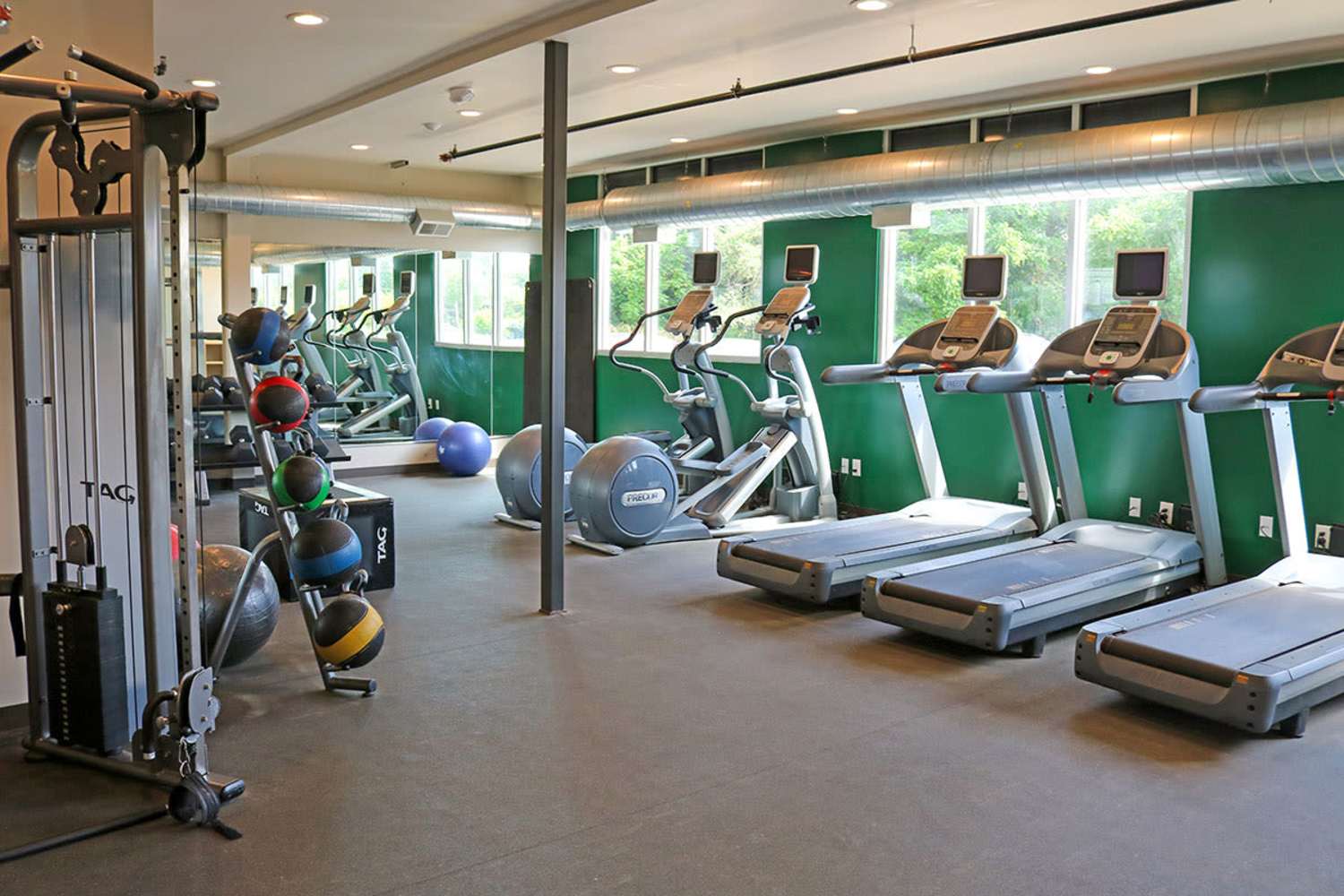 Fitness center with treadmills at The Quarters at East Lansing in East Lansing, Michigan