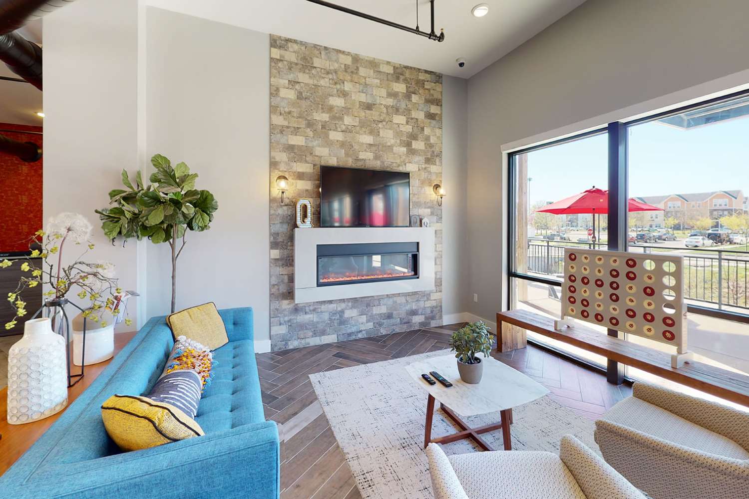 Resident lounge with fireplace at The Quarters at Bloomington in Bloomington, Indiana