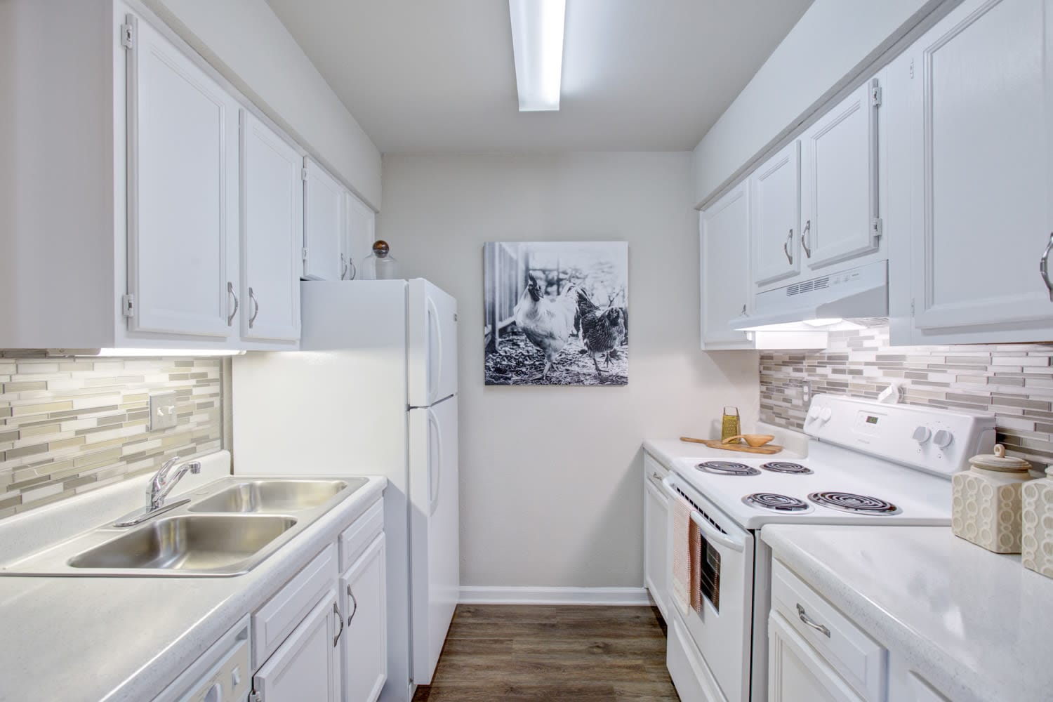Beautiful modern kitchen with white appliances at Lincoya Bay Apartments & Townhomes in Nashville, Tennessee