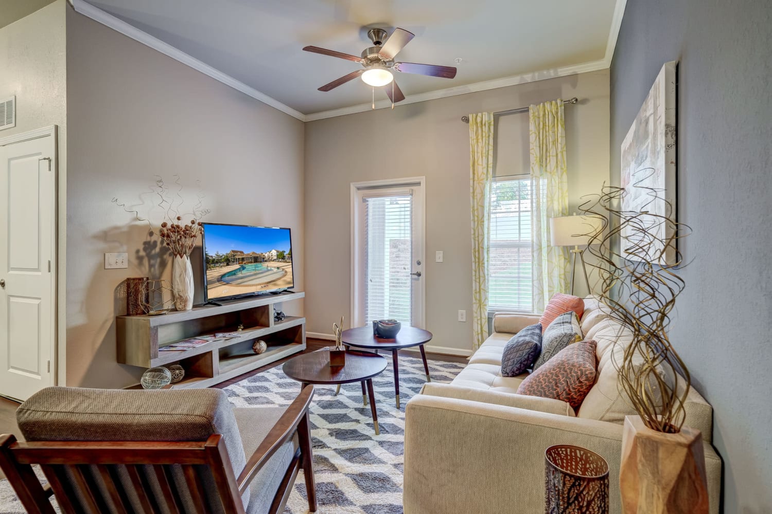 Livingroom with door to patio at Creekside at Greenlawn Apartment Homes in Columbia, South Carolina