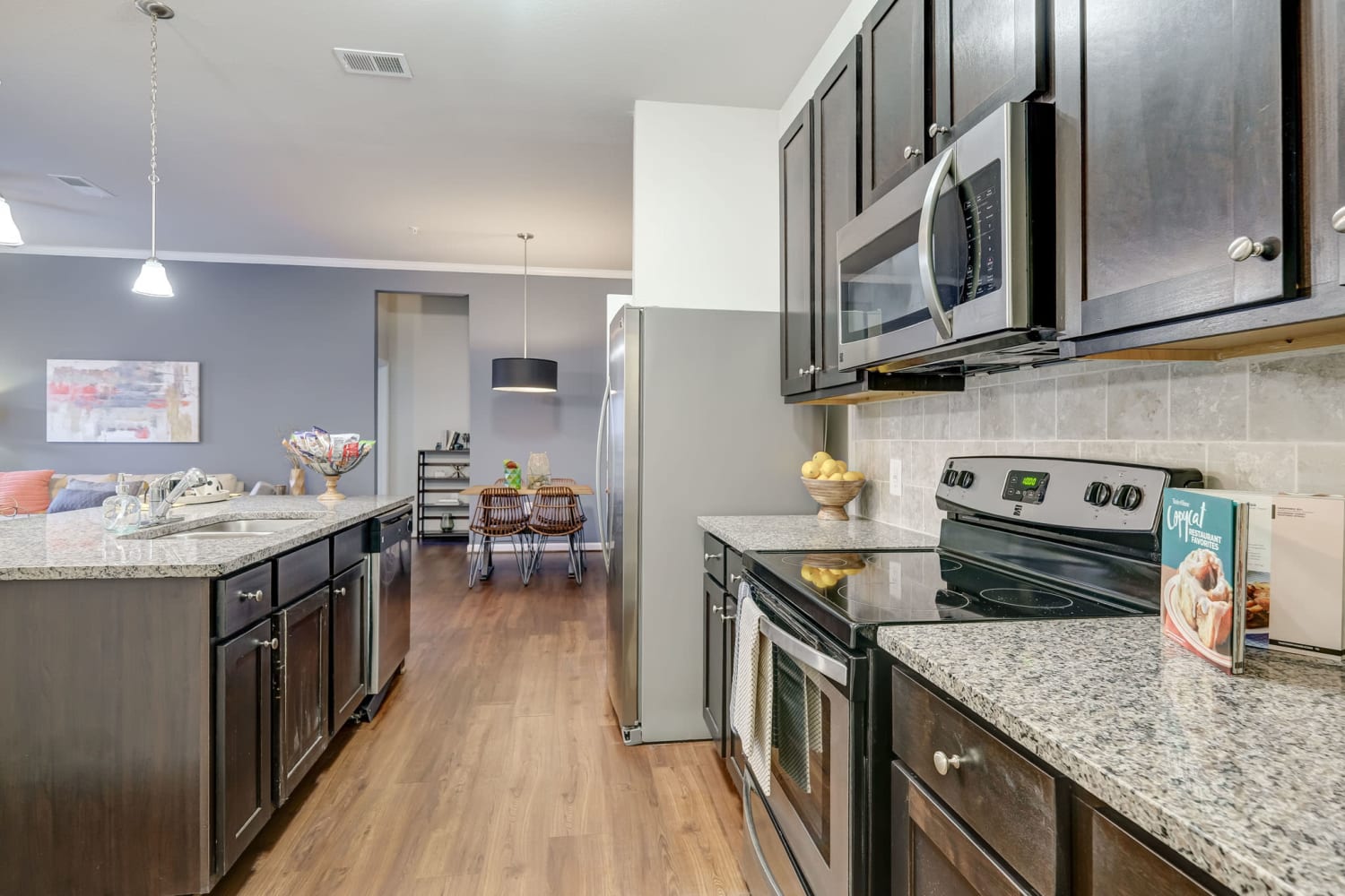 Open, modern Kitchen with island at Creekside at Greenlawn Apartment Homes in Columbia, South Carolina