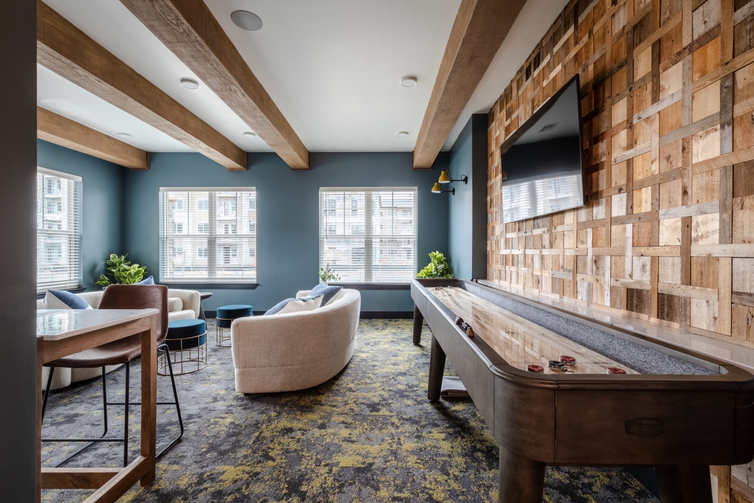 Shuffle board in the clubhouse at Ladora Modern Apartments in Denver, Colorado