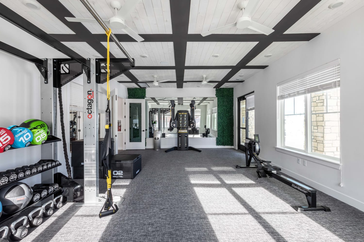 Fitness center with a lot of equipment at The Prospector Modern Apartments in Castle Rock, Colorado