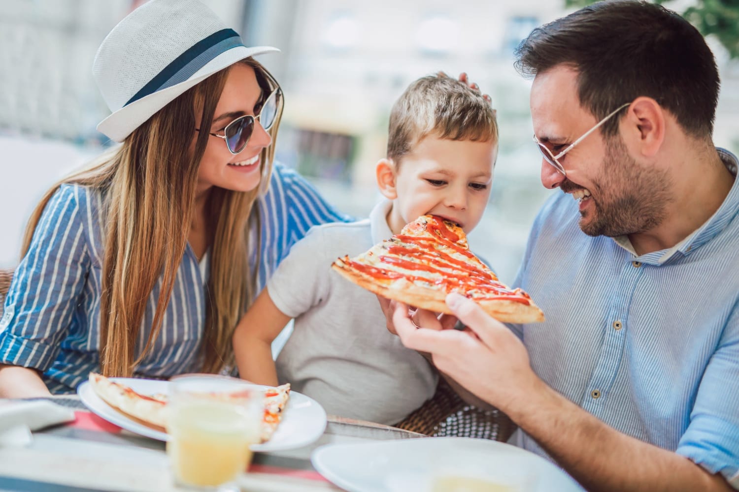 Resident family out eating pizza near Elevation Townhomes in Phoenix, Arizona
