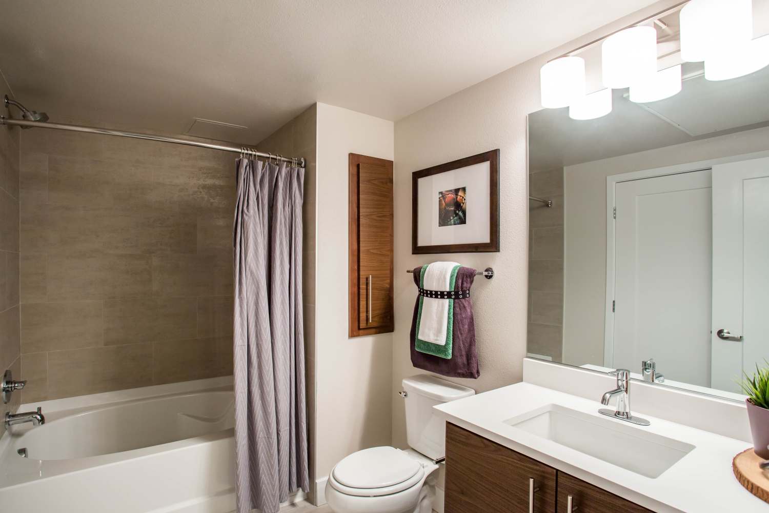 Bathroom with mirror, sink and bathtub at Franklin 299 in Redwood City, California