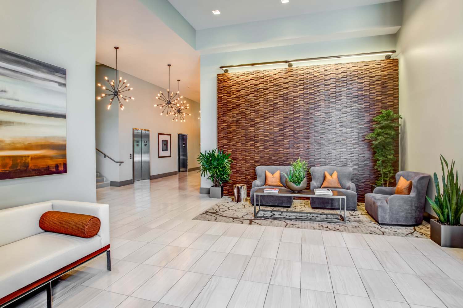 Community lounge area with couch at Franklin 299 in Redwood City, California