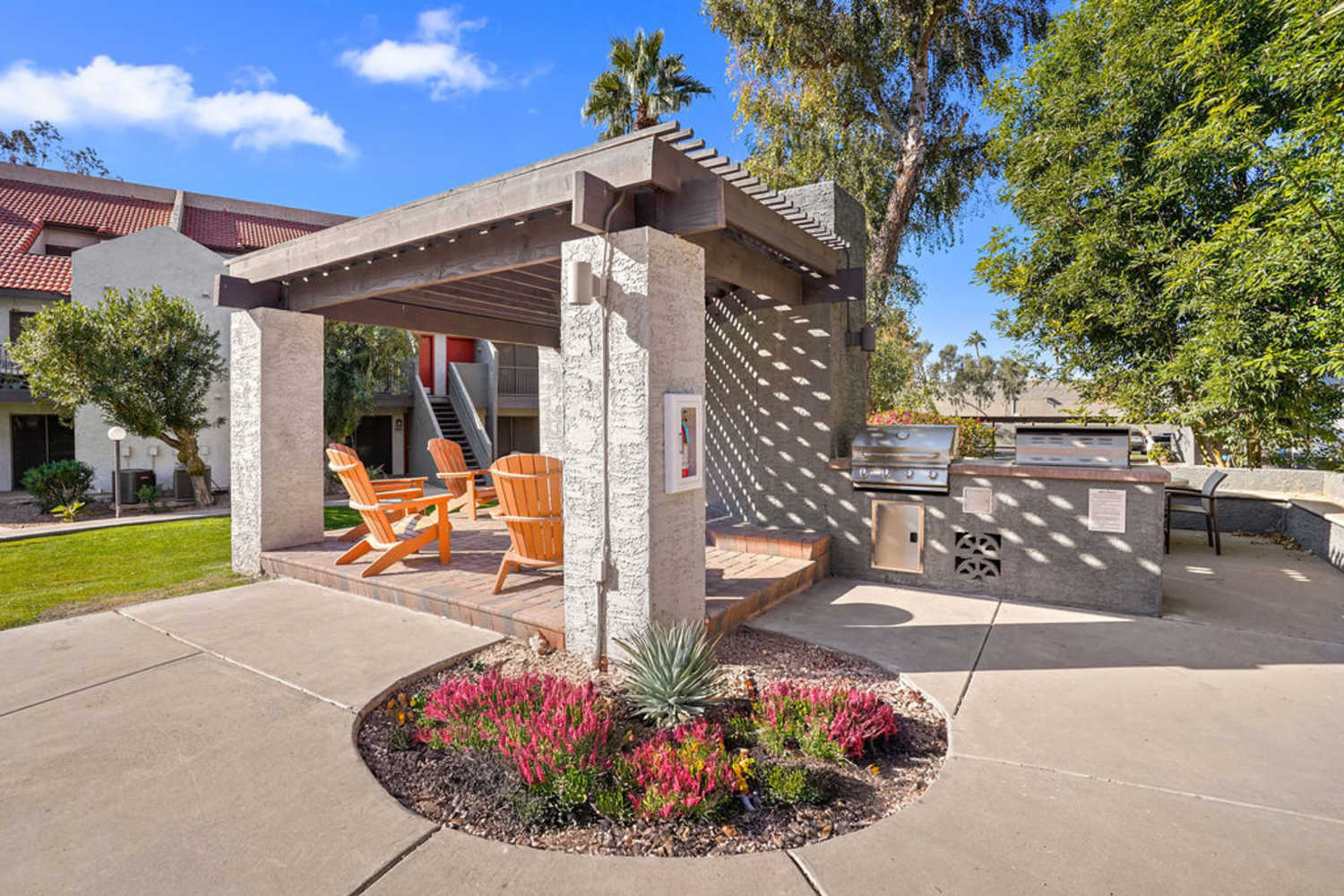 Outdoor seat by the grill at Waterford Place Apartments in Mesa, Arizona