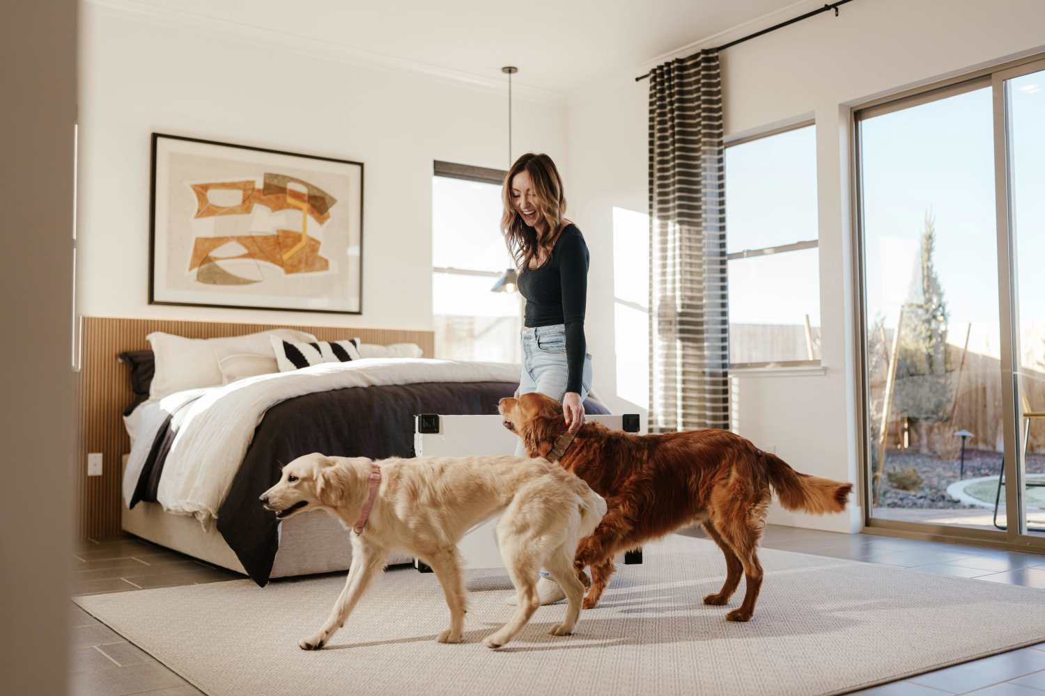 A resident walking her pet dogs at RIVA Solana Beach in Solana Beach,California 