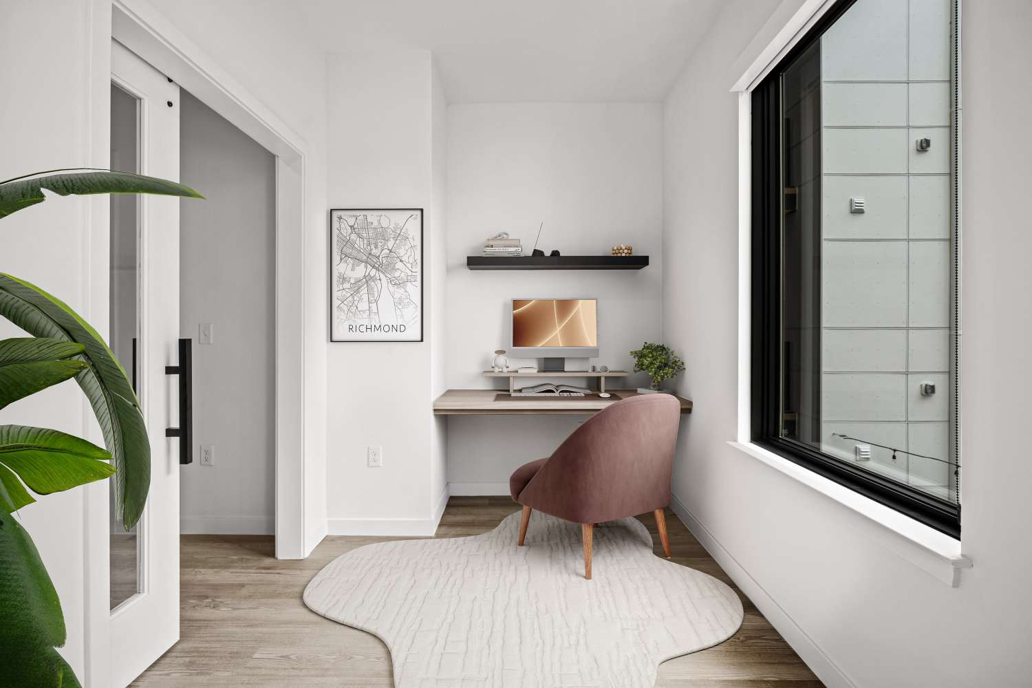 Apartment office desk with a grid shelf behind it at 1510 Belleville in Richmond, Virginia