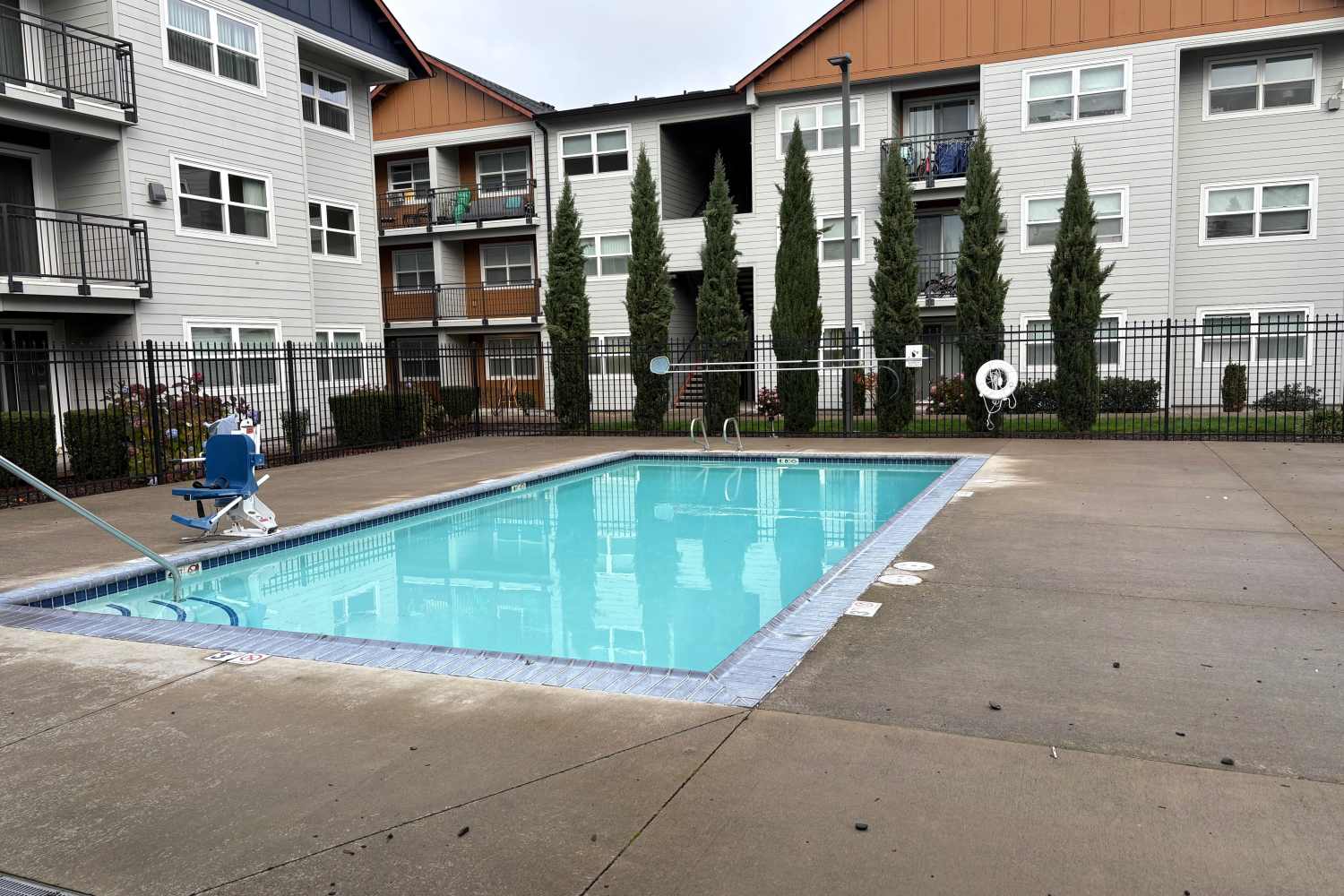 Apartment exterior and pool at K West Apartments in Vancouver, Washington