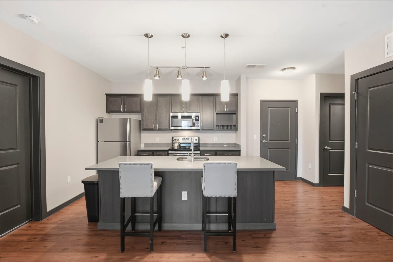 Kitchen with wood-style flooring at Bridge Park in Dublin, Ohio