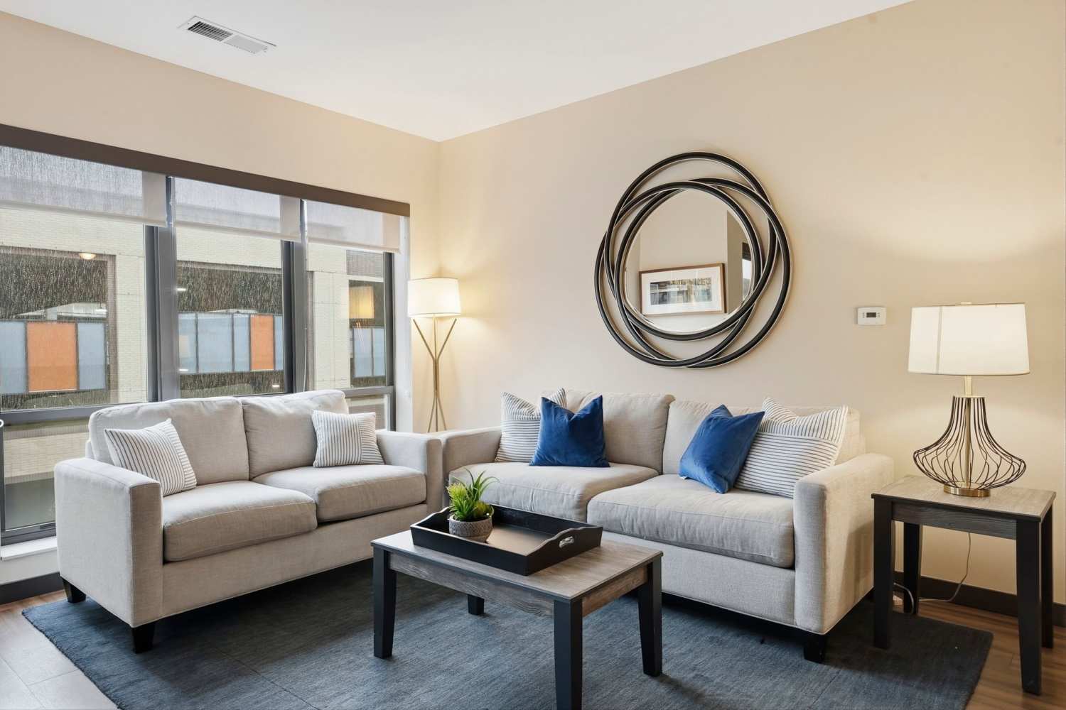 Tall windows in an apartment living room at Bridge Park in Dublin, Ohio