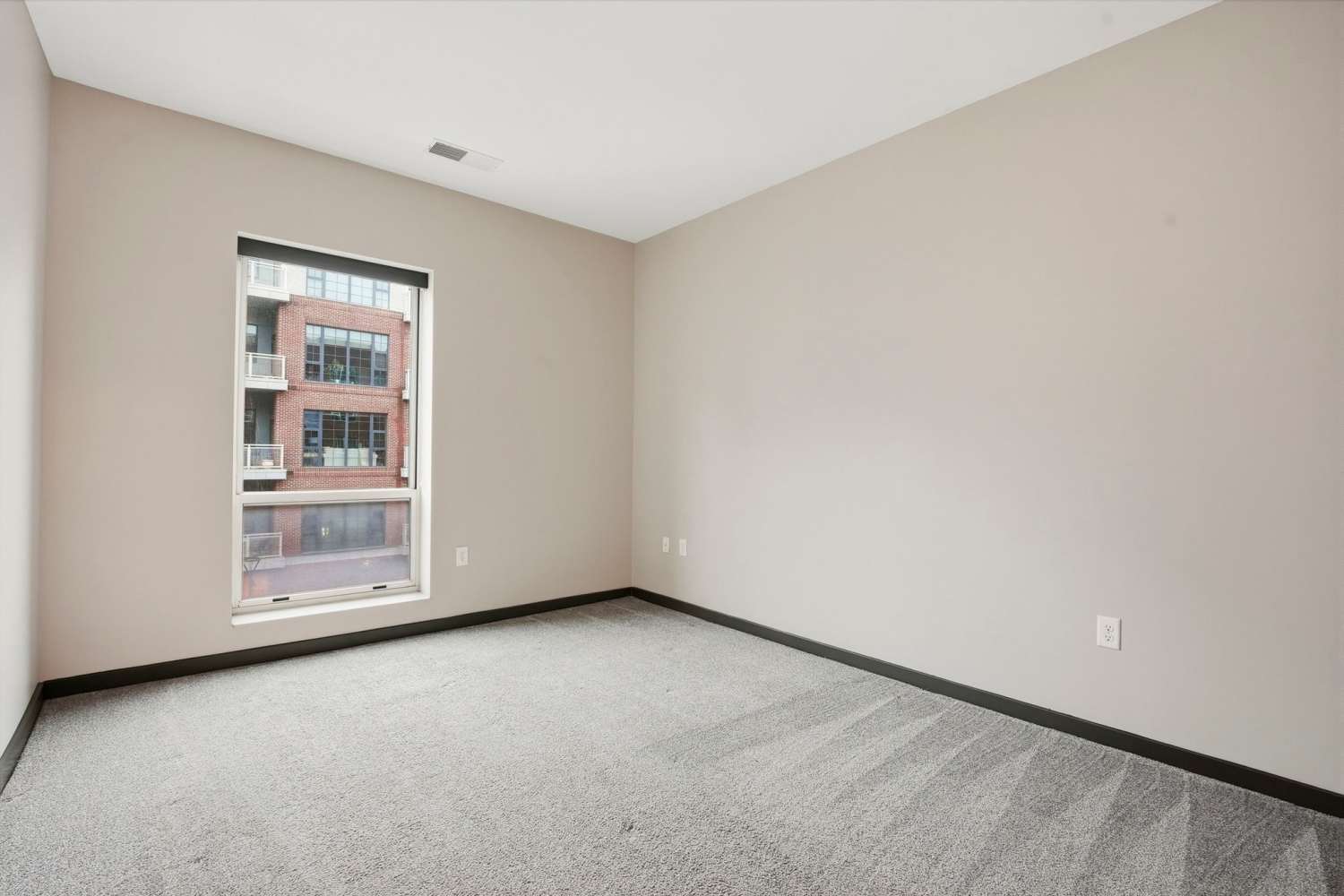 Bedroom with carpet at Bridge Park in Dublin, Ohio
