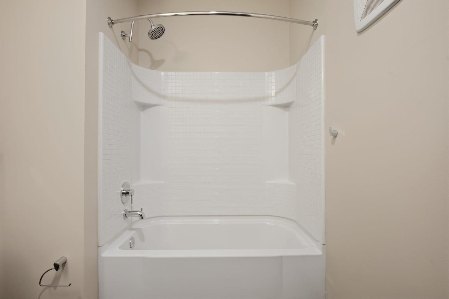Shower and tub in an apartment bathroom at Bridge Park in Dublin, Ohio