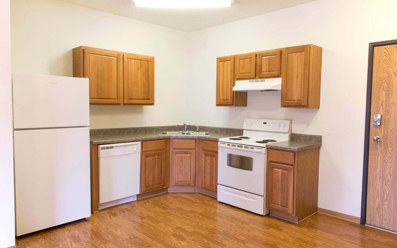 Apartment kitchen with wood flooring at Westwood Village in Ames, Iowa
