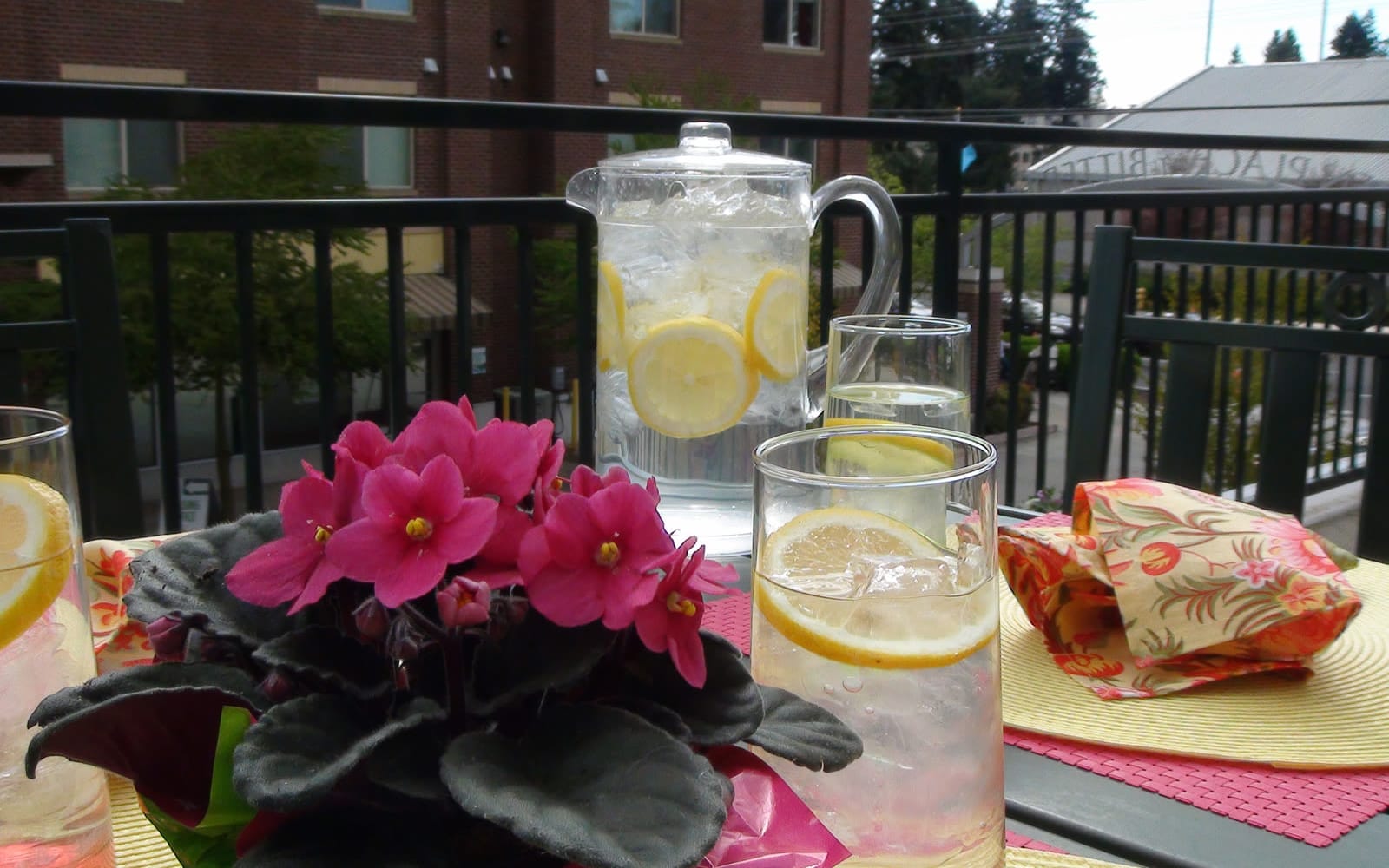 A balcony with dining table set up at The Cambridge at Bitter Lake in Seattle, Washington