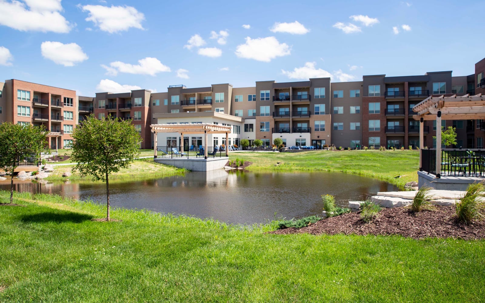 Landscaping and a pond at Attivo Trail Waukee in Waukee, Iowa