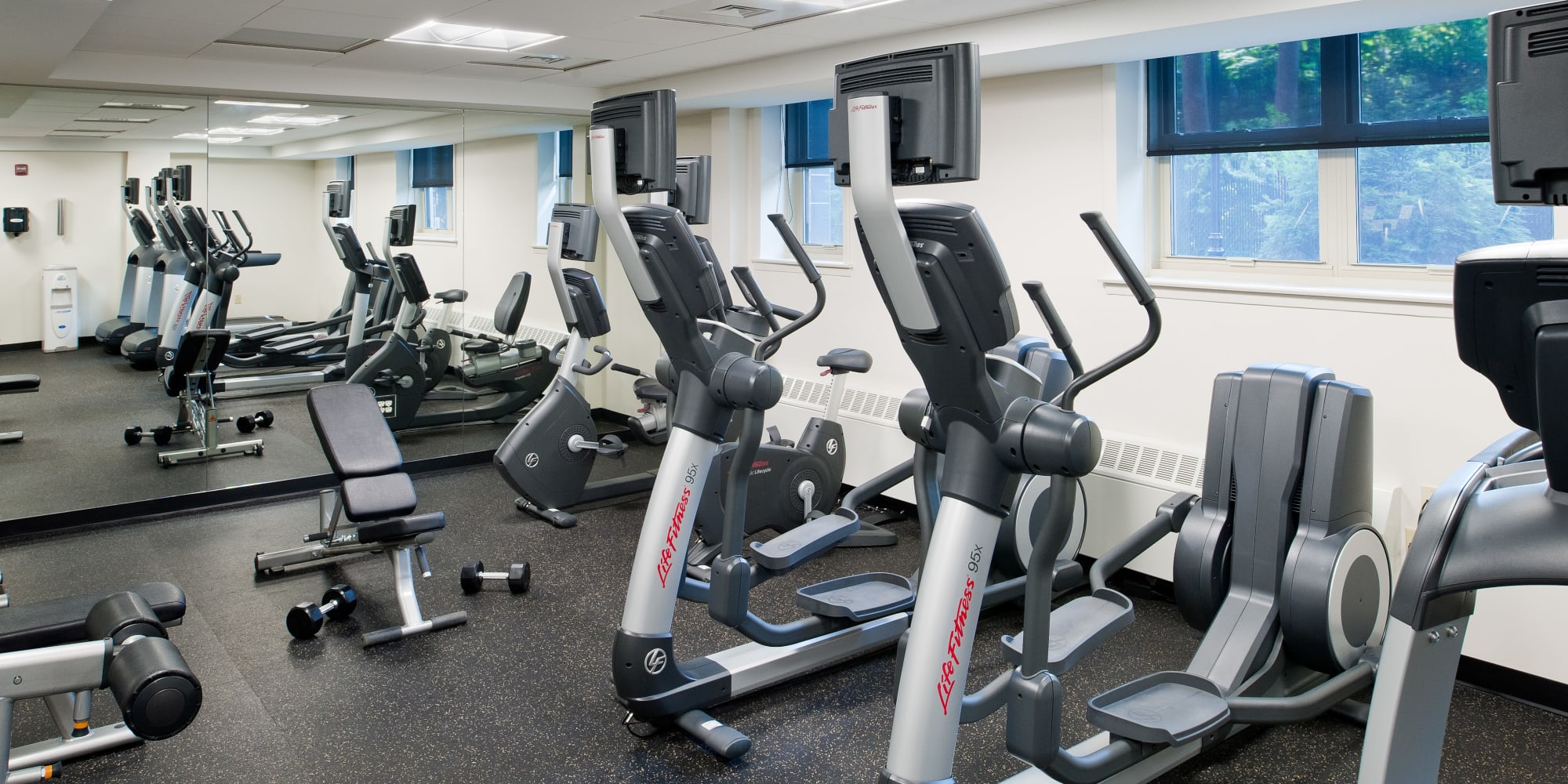Fitness center with cardio machines at Camelot Court in Brighton, Massachusetts