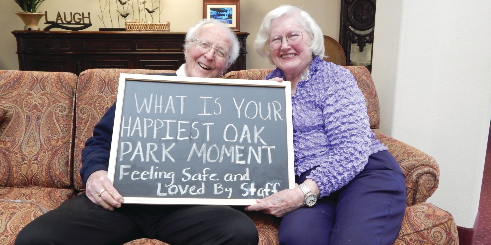 Residents holding a sign about their happiest moment at Oak Park Retirement in Salisbury, North Carolina