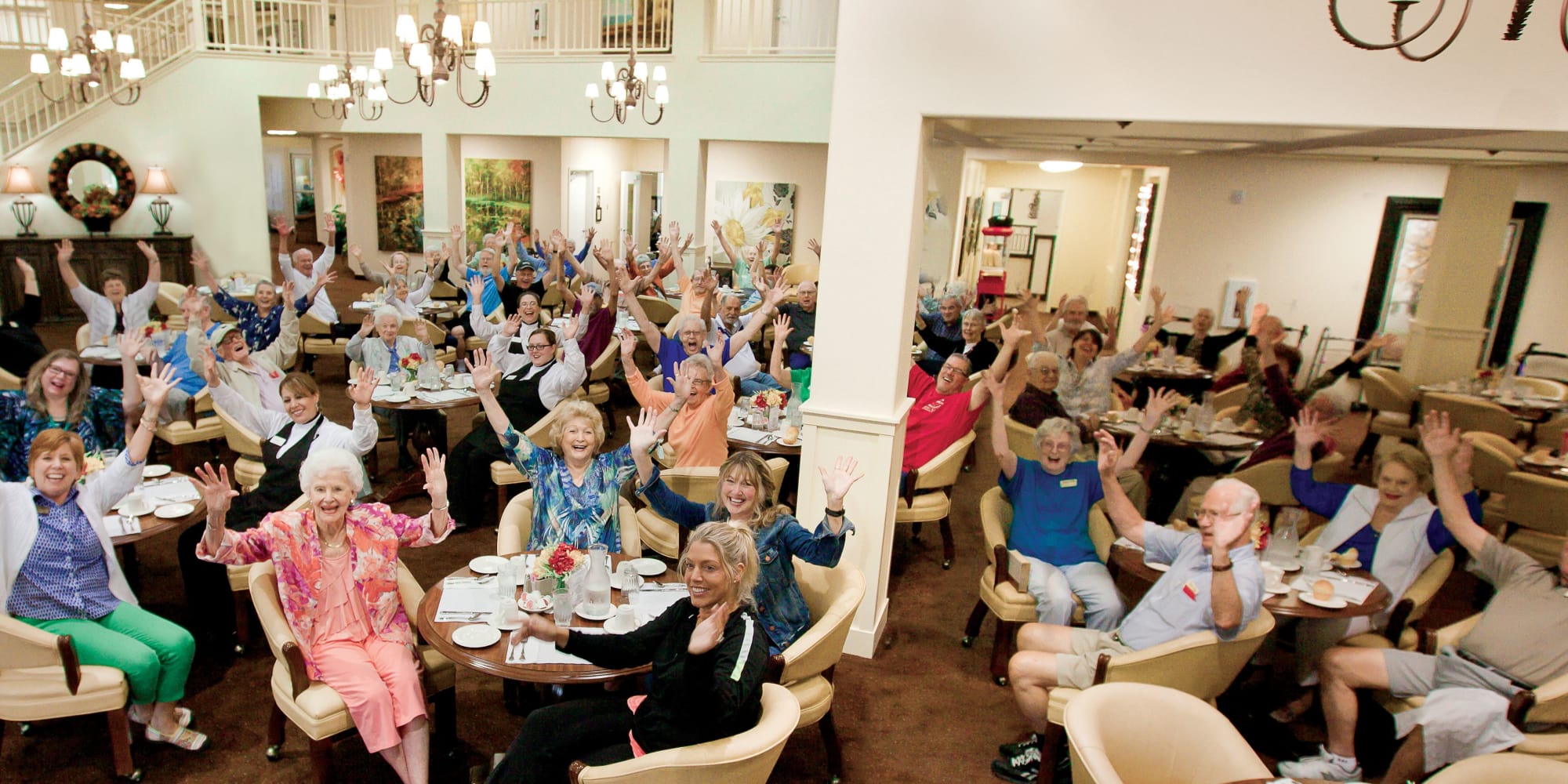 Residents and staff in the dining room at Pioneer Ridge Gracious Retirement Living in McKinney, Texas