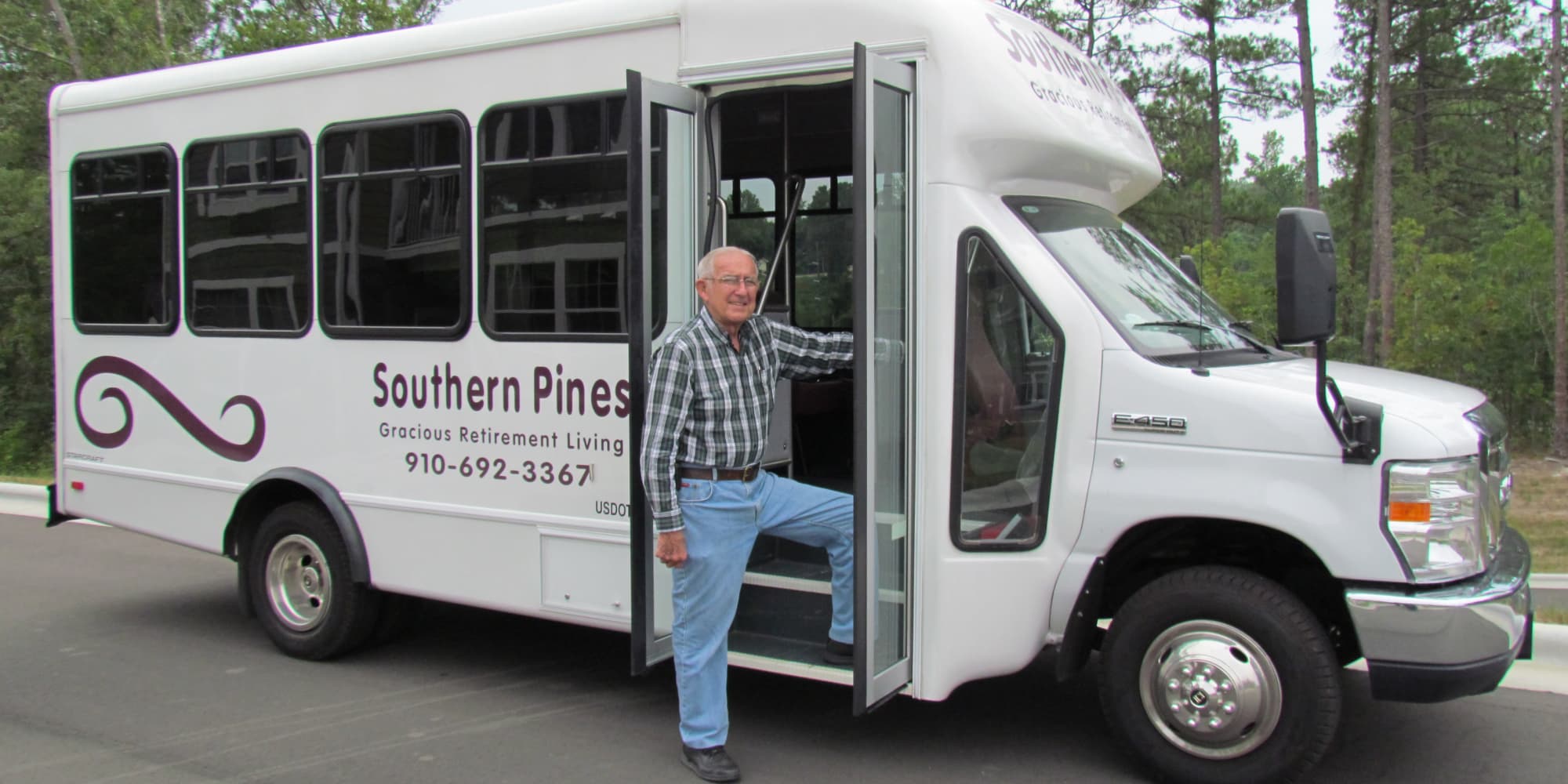 A resident stepping into the community bus at Southern Pines Gracious Retirement Living in Southern Pines, North Carolina