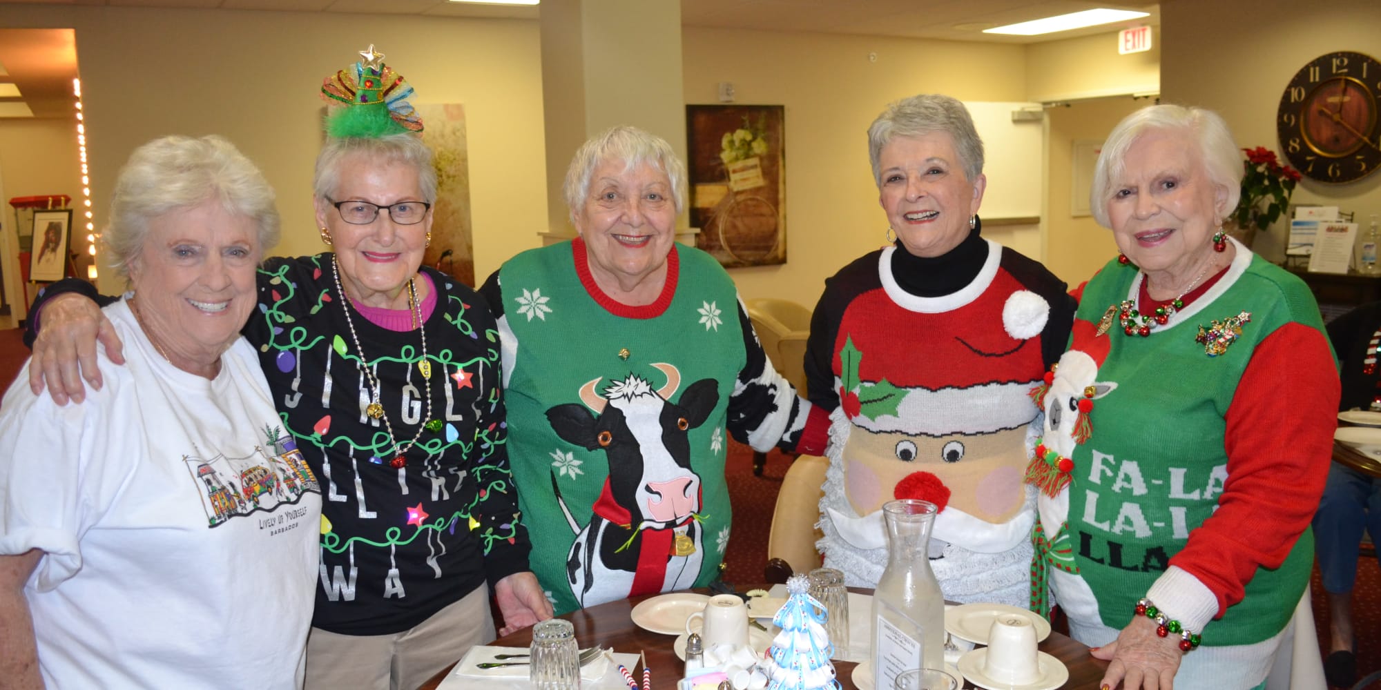 Residents in festive holiday sweaters at Edgewood Point Assisted Living in Beaverton, Oregon