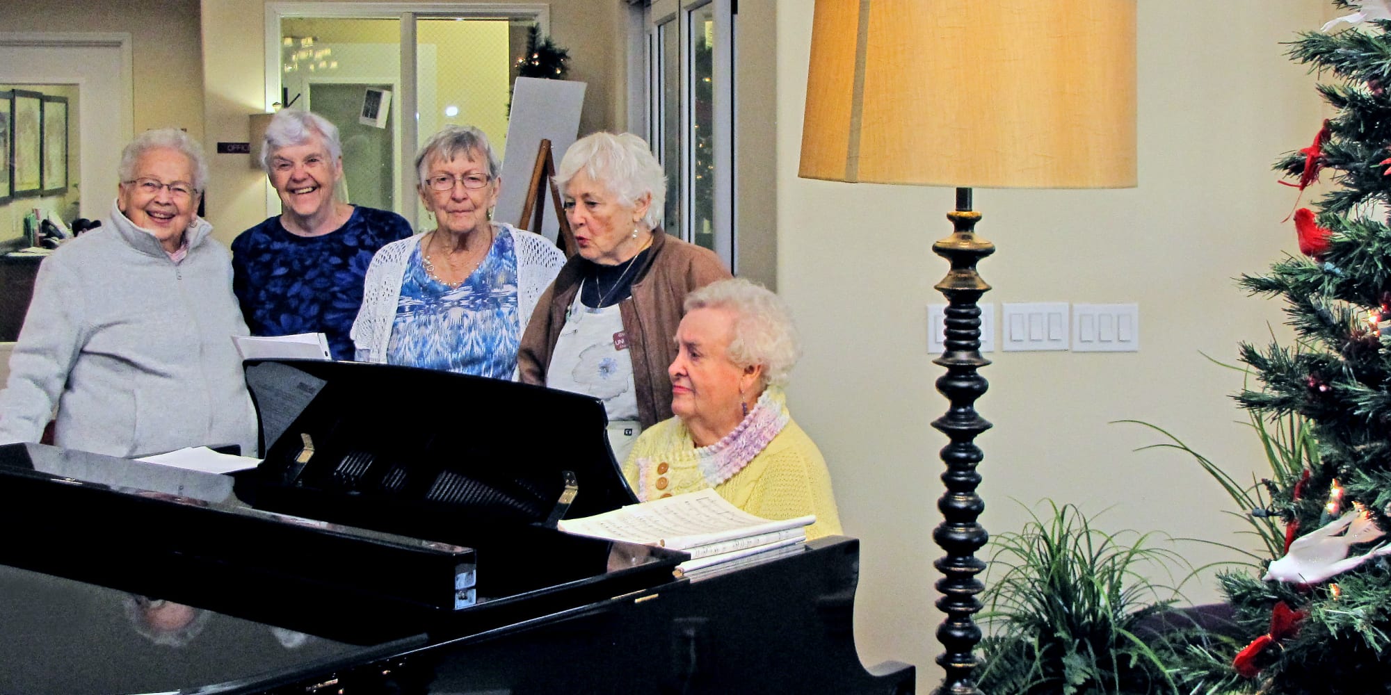 A resident playing the piano for other residents at Amber Park in Pickerington, Ohio