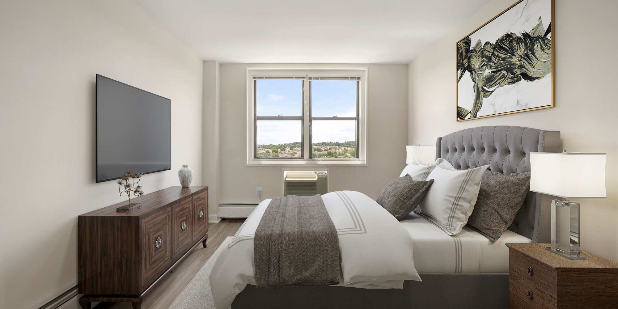 Master bedroom with wood-style flooring at Parkside Place in Cambridge, Massachusetts