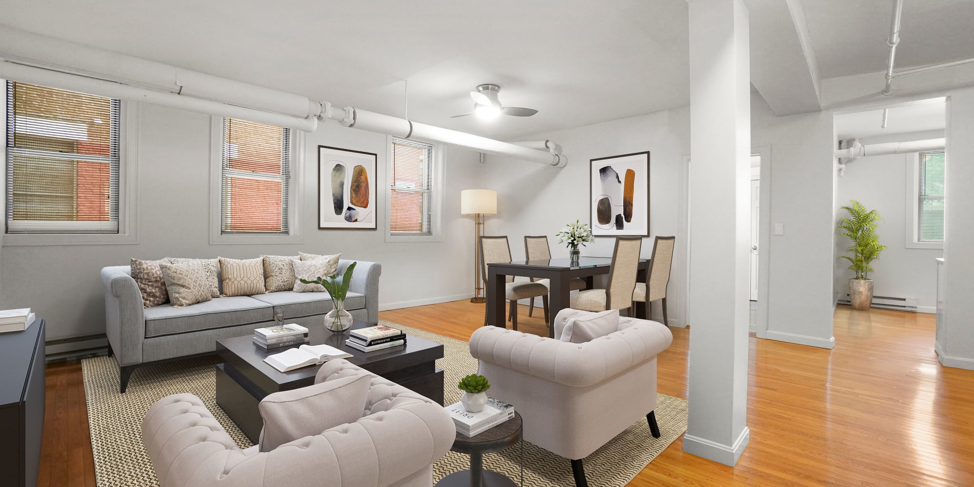 Large living space with wood-style flooring at Atrio Boston in Boston, Massachusetts