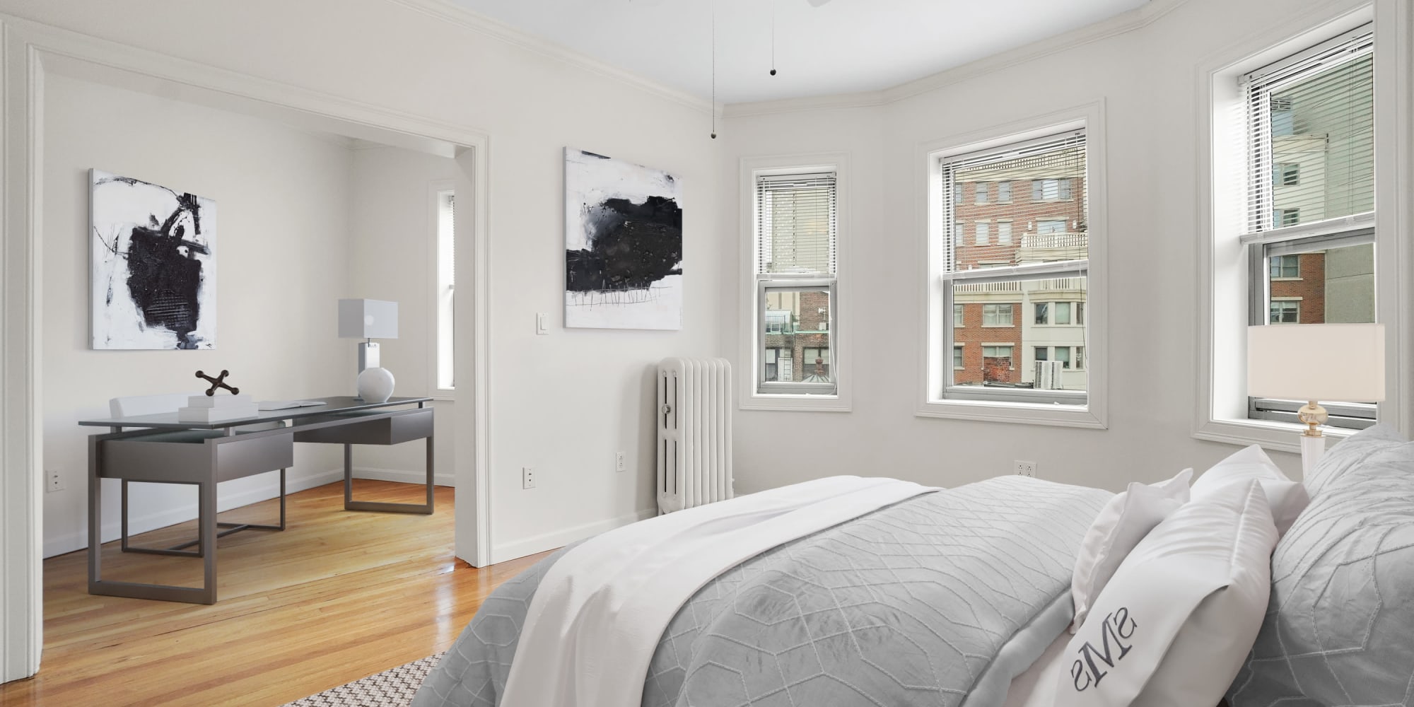 Master bedroom with wood-style flooring at Atrio Boston in Boston, Massachusetts