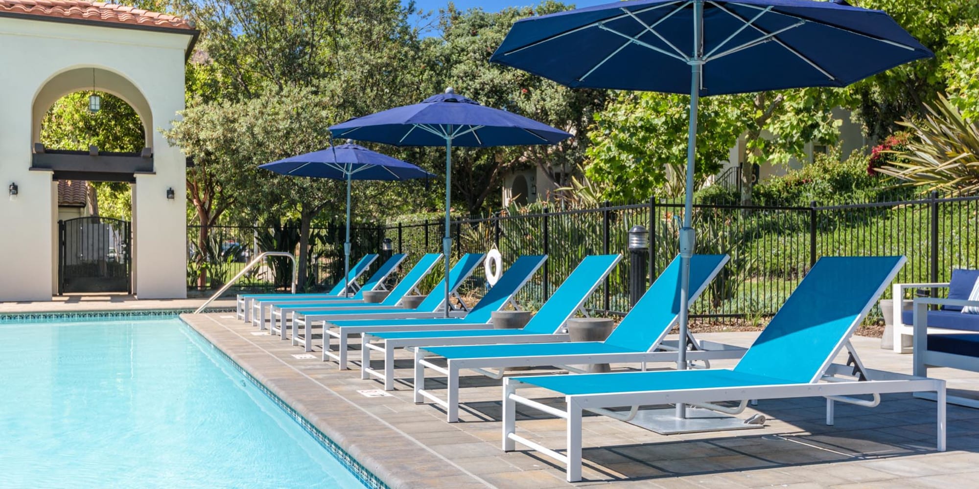 Chaise lounge chairs around the swimming pool at Mission Hills in Camarillo, California