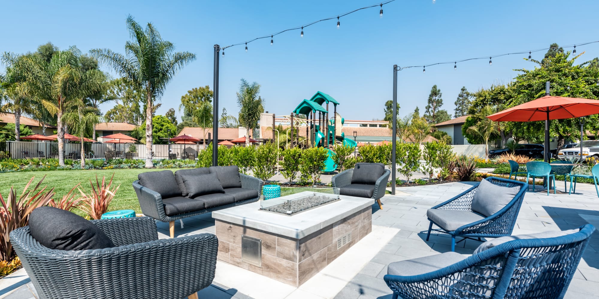 Cozy fire pit area, next to the large gated swimming pool and playground at Sofi Ventura in Ventura, California