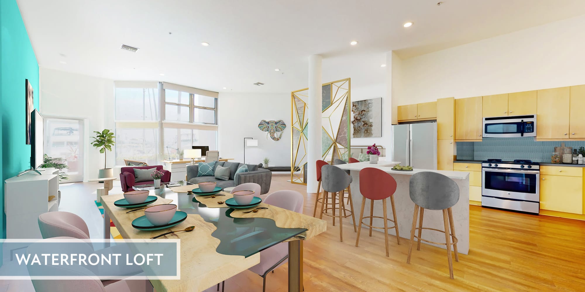 Spacious loft apartment's dining room, modern kitchen with stainless steel appliances, and hardwood floors at Esprit Marina del Rey in Marina del Rey, California