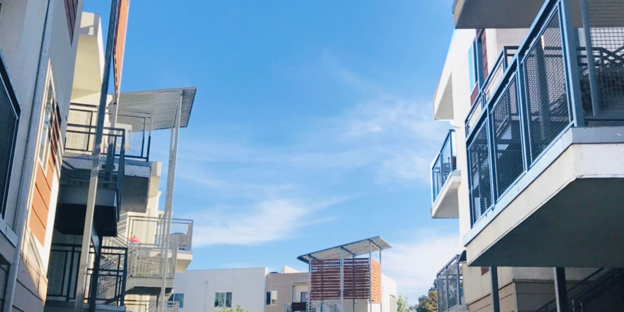 Private balconies outside apartment homes on a beautiful day at Citron in Ventura, California