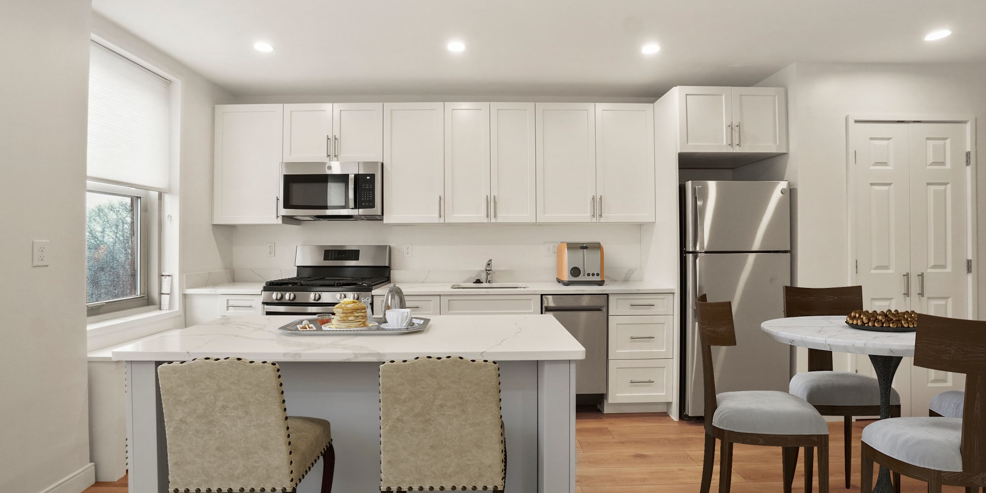 Beautiful kitchen with stainless-steel appliances at Camelot Court in Brighton, Massachusetts