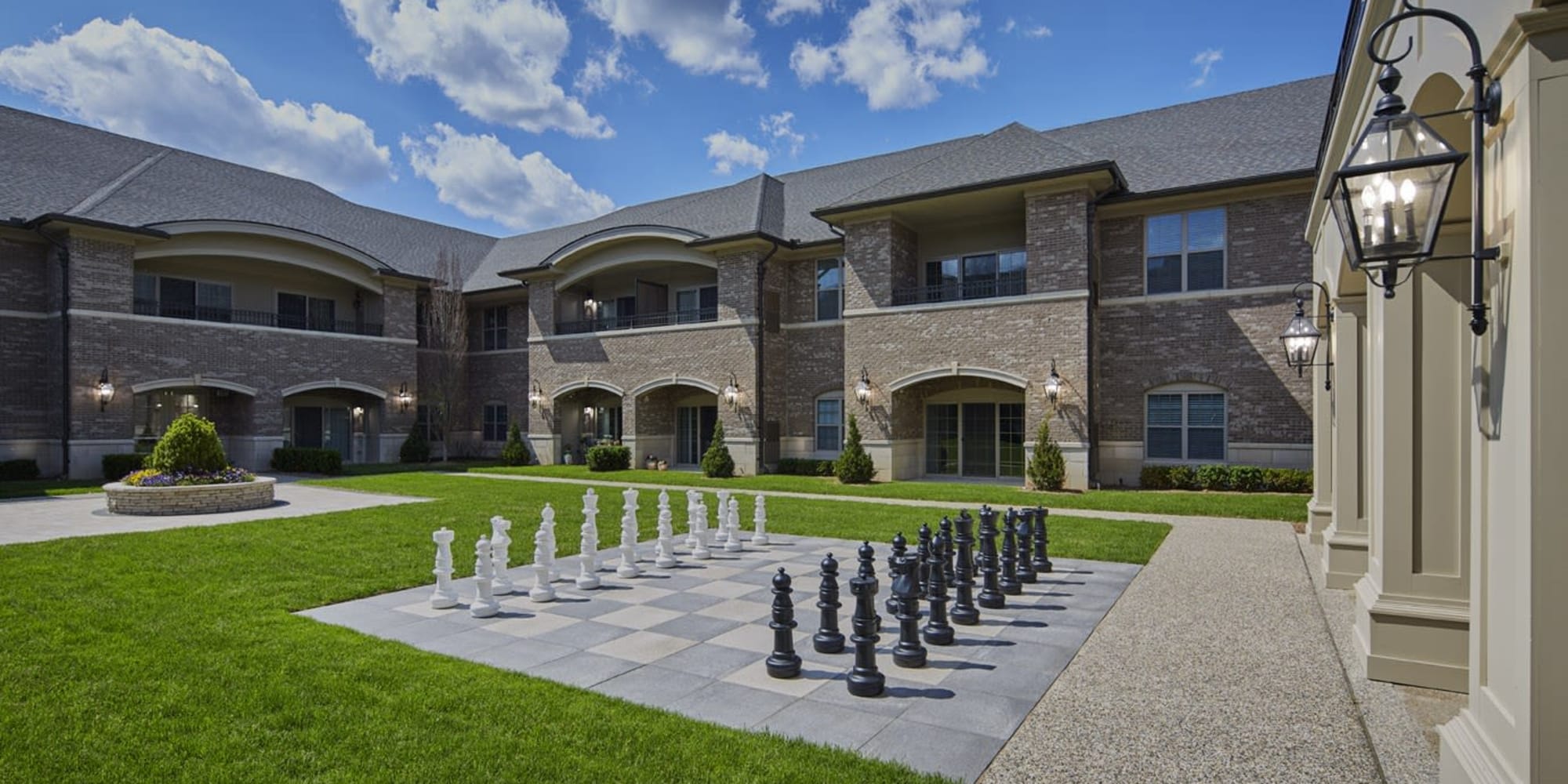 Outdoor courtyard with life size chess board at Blossom Ridge in Oakland Charter Township, Michigan 
